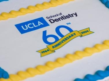 cake that reads "UCLA School of Dentistry 60th Anniversary