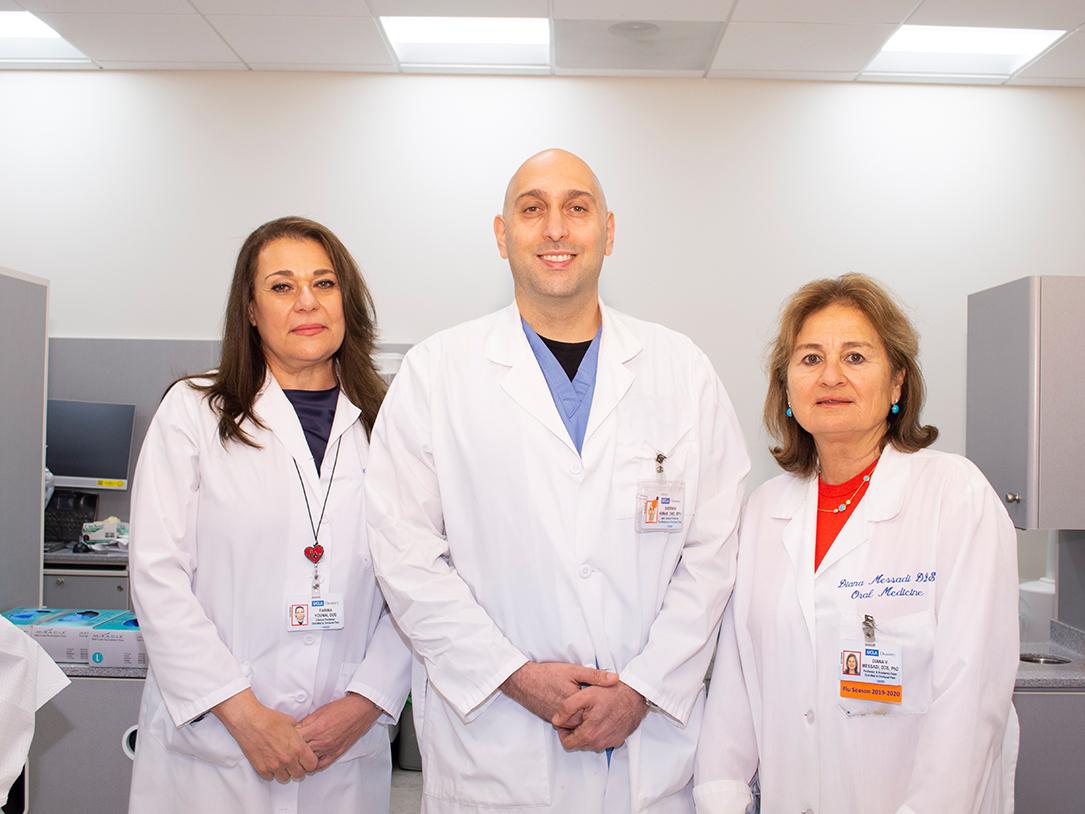 Drs. Farbia Younai, Sherwin Arman and Diana Messadi in a clinic setting.