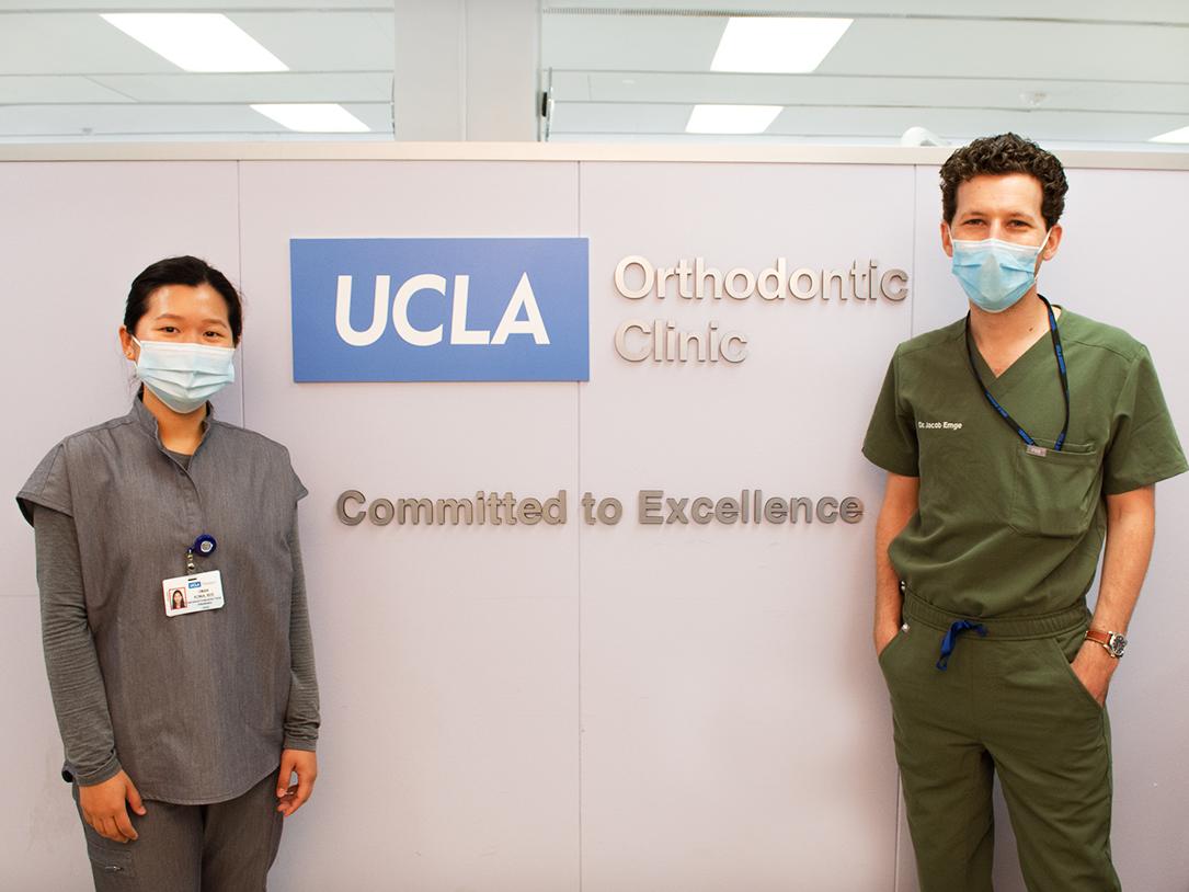Orthodontics residents in front of the new UCLA Orthodontic Clinic signage.