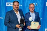 Dr. Mark Ortega and Dr. Paul Krebsbach pose against a blue backdrop