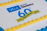 cake that reads "UCLA School of Dentistry 60th Anniversary