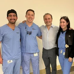 Kami Hoss, centered between four UCLA dental students.