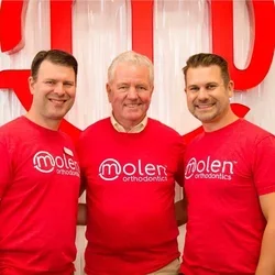 Dr. Bruce Molen, center, with his sons