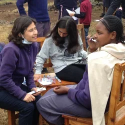 Yvonne Hernandez-Kapila (left) helping with survey work in Kenya