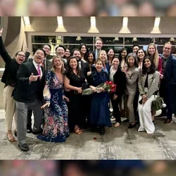 Group of people celebrating in a hotel lobbby