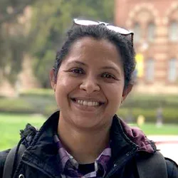 Dr. Thooyamani is smiling in a headshot