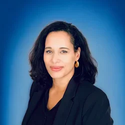 Anna Spain Bradley in front of blue background