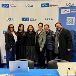 Six people in a UCLA Dentistry-branded booth