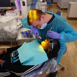 In a March 2024 visit to the Thomas R. Bales Orthodontic Clinic, Dr. Tyler Brennan bonded small buttons for Heavenli to wear elastics, helping her bite fit properly.