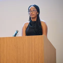 Honesty Boone speaking at a podium