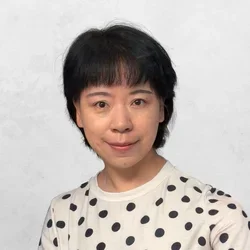 Dr. Fang Wei in a polka-dot shirt