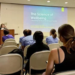 students attending lecture on the science of wellbeing