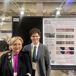 Dr. Nadia Chugal and Dr. Ryan Needle in front of Ryan's research poster