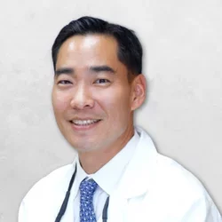 Dr. Jong Wook Lee is wearing a white doctor's coat