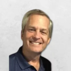 Dr. Dautremont is wearing a navy blue shirt.