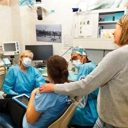 Dental Anesthesiologist Dr. Christine Quinn and Dr. Sung prepare Corinne Eisler for her bi-annual cleaning, with support from mom, Michelle.