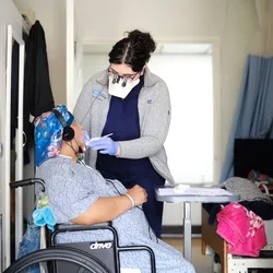 Dental care to a patient in a wheelchair