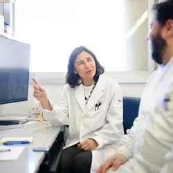 Dr. Yvonne Hernandez-Kapila and Allan Radaic collaborating