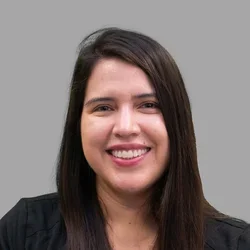 Dr. Damaris Arriola Zarate is wearing black scrubs.