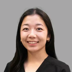 Dr. Michelle Chiang is dressed in black scrubs.