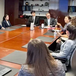 Group of people at conference table 