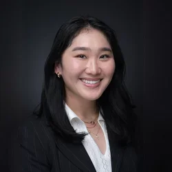 Tiffany chen, smiling in a black blazer