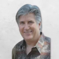 Dr. Uhrik is wearing a multi-colored shirt.