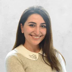 Dr. Valentina Babuchyan smiling against a gray background
