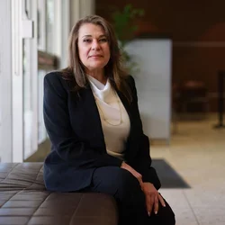 Dr. Fariba Younai, sitting