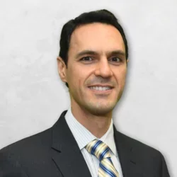 Dr. Zaher George Jabbour is wearing a suit and tie.