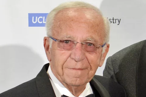 Dr. Henry Cherrick, wearing a tuxedo and glasses