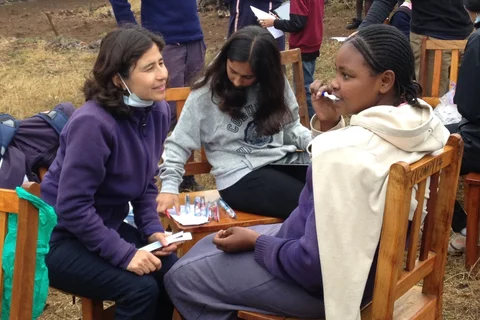 Yvonne Hernandez-Kapila (left) helping with survey work in Kenya