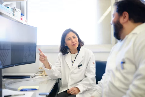 Dr. Yvonne Hernandez-Kapila and Allan Radaic collaborating