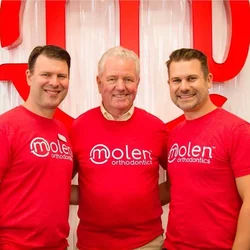 Dr. Bruce Molen, center, with his sons