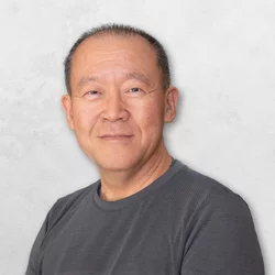 Dr. Thomas Lee wearing a gray shirt